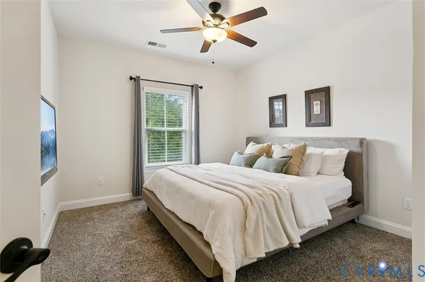 a living room with furniture a table and a painting