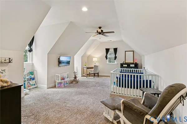 a living room with furniture gym equipment and a flat screen tv
