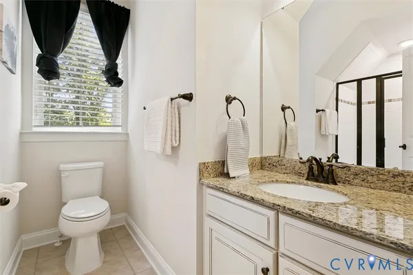 a bedroom with bed and wooden floor