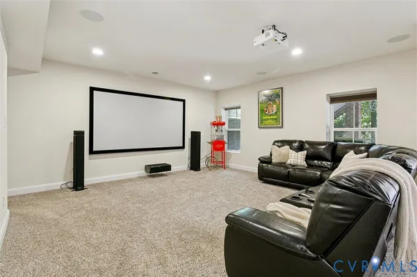 an aerial view of residential houses with outdoor space and trees