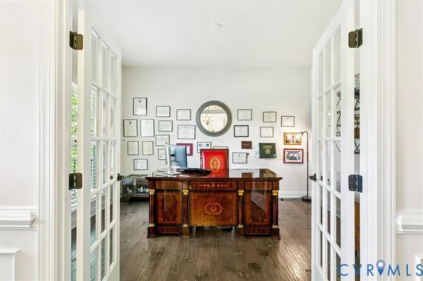 a view of a dining room with furniture and wooden floor