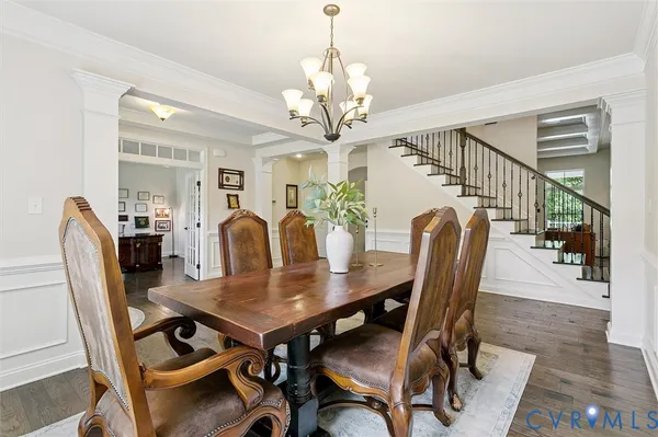 a living room with furniture fireplace and a large window