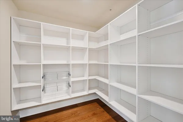 a spacious bedroom with a bed and a couch