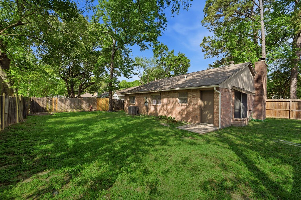 4542 Algernon Drive Spring, TX 77373 - Photo 18 of 19 a view of a house with a yard