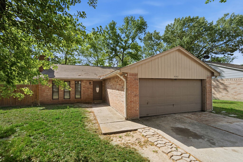 4542 Algernon Drive Spring, TX 77373 - Photo 2 of 19 front view of a house with a yard
