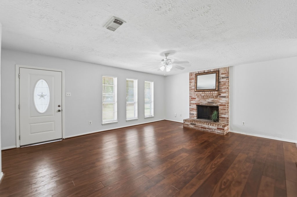 4542 Algernon Drive Spring, TX 77373 - Photo 8 of 19 a view of an empty room with wooden floor and a window