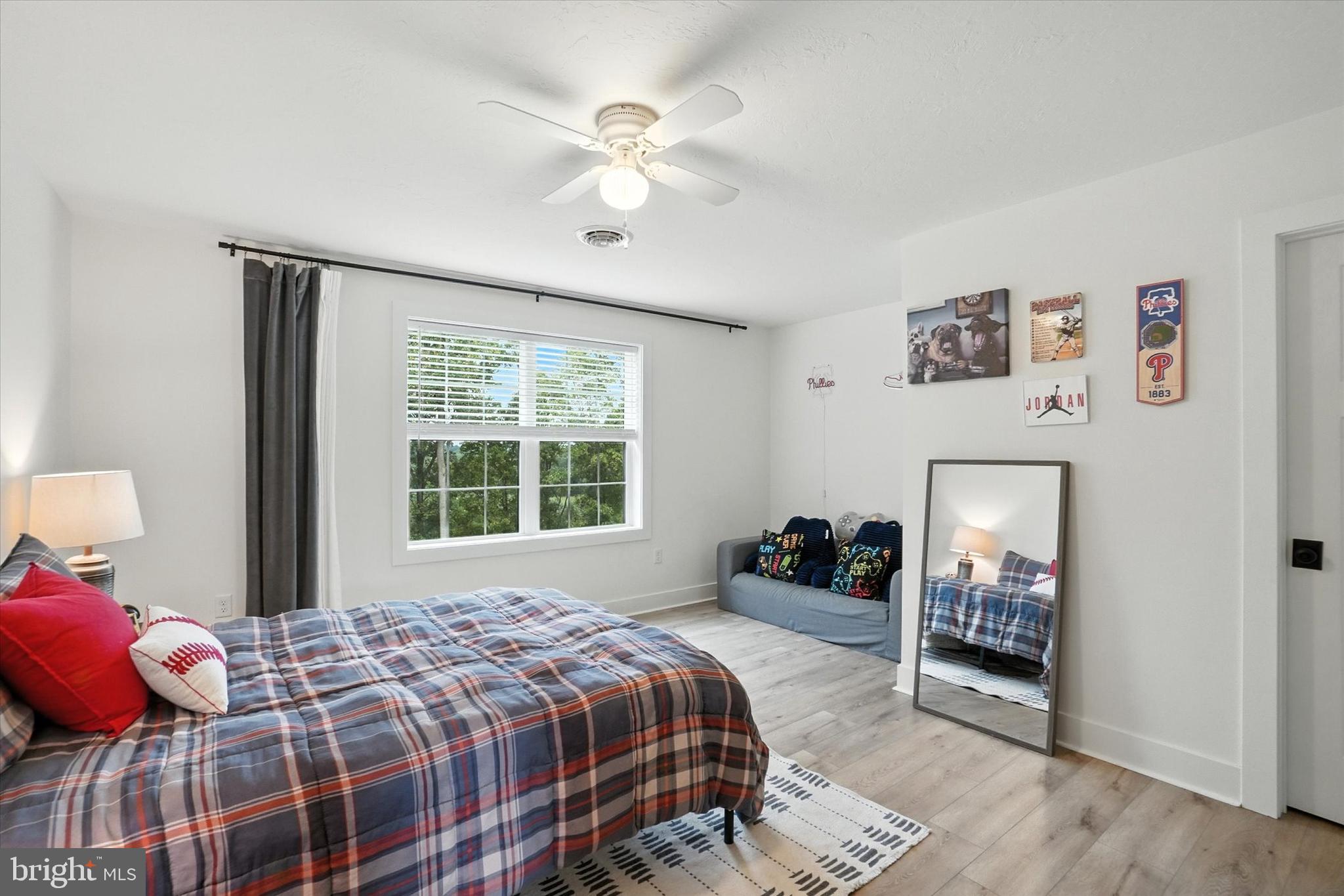 894 Ridgeview Road Seven Valleys, PA 17360 - Photo 17 of 39 a bedroom with a bed and dresser