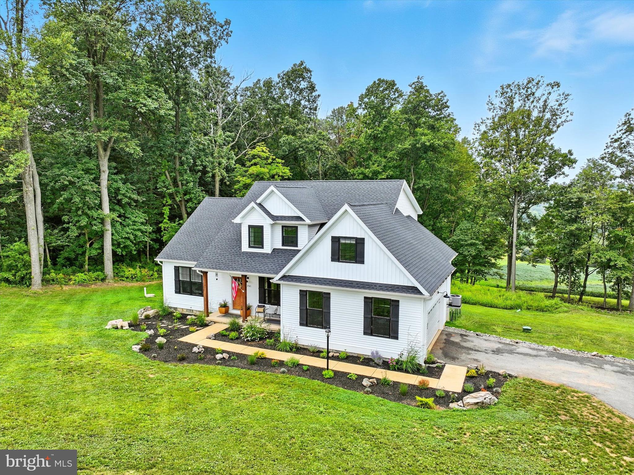 894 Ridgeview Road Seven Valleys, PA 17360 - Photo 2 of 39 a aerial view of a house with swimming pool next to a big yard
