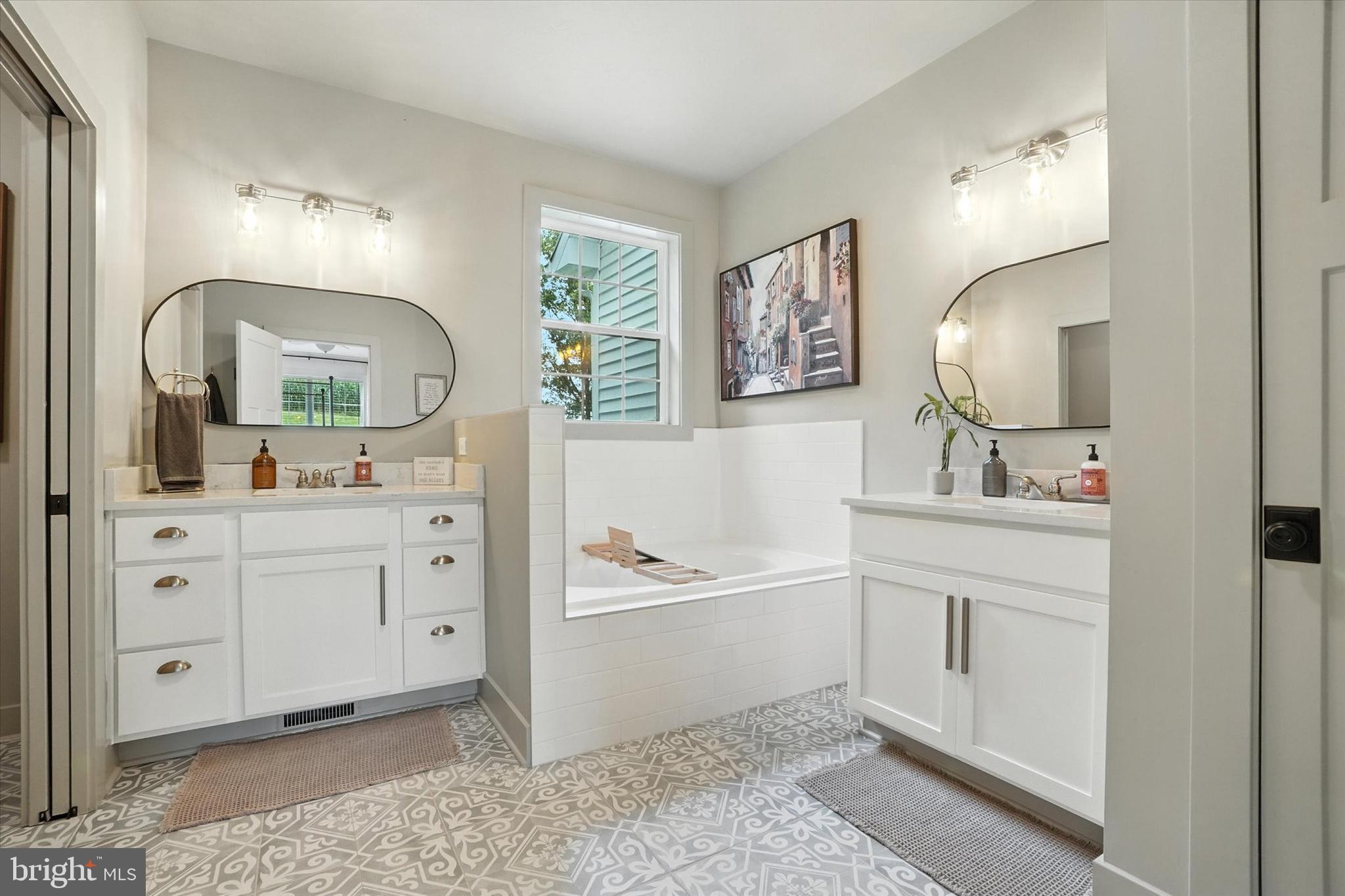 894 Ridgeview Road Seven Valleys, PA 17360 - Photo 24 of 39 a spacious bathroom with 2 sink tub and a mirror