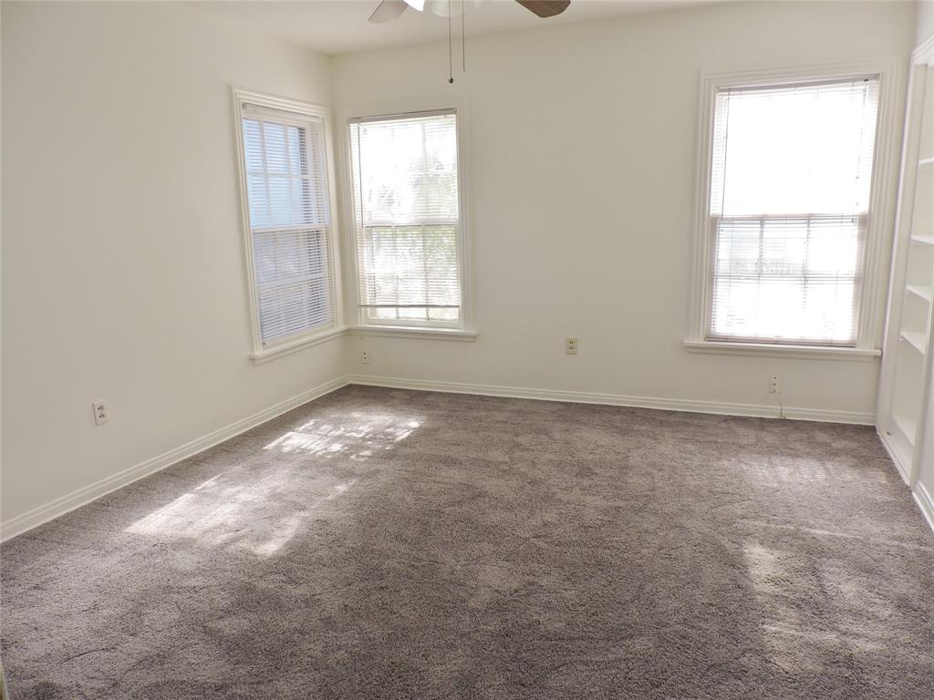 3425 Westcliff Road South Fort Worth, TX 76109 - Photo 15 of 22 Spare room with plenty of natural light, carpet flooring, and a ceiling fan