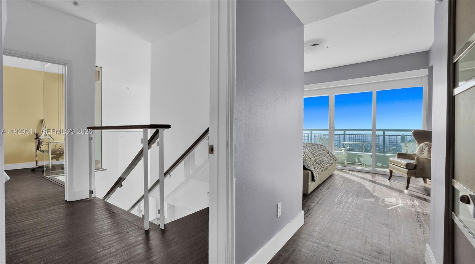 60 Southwest 13th Street, Unit 4607 Miami, FL 33130 - Photo 15 of 39 a living room with furniture and a large window
