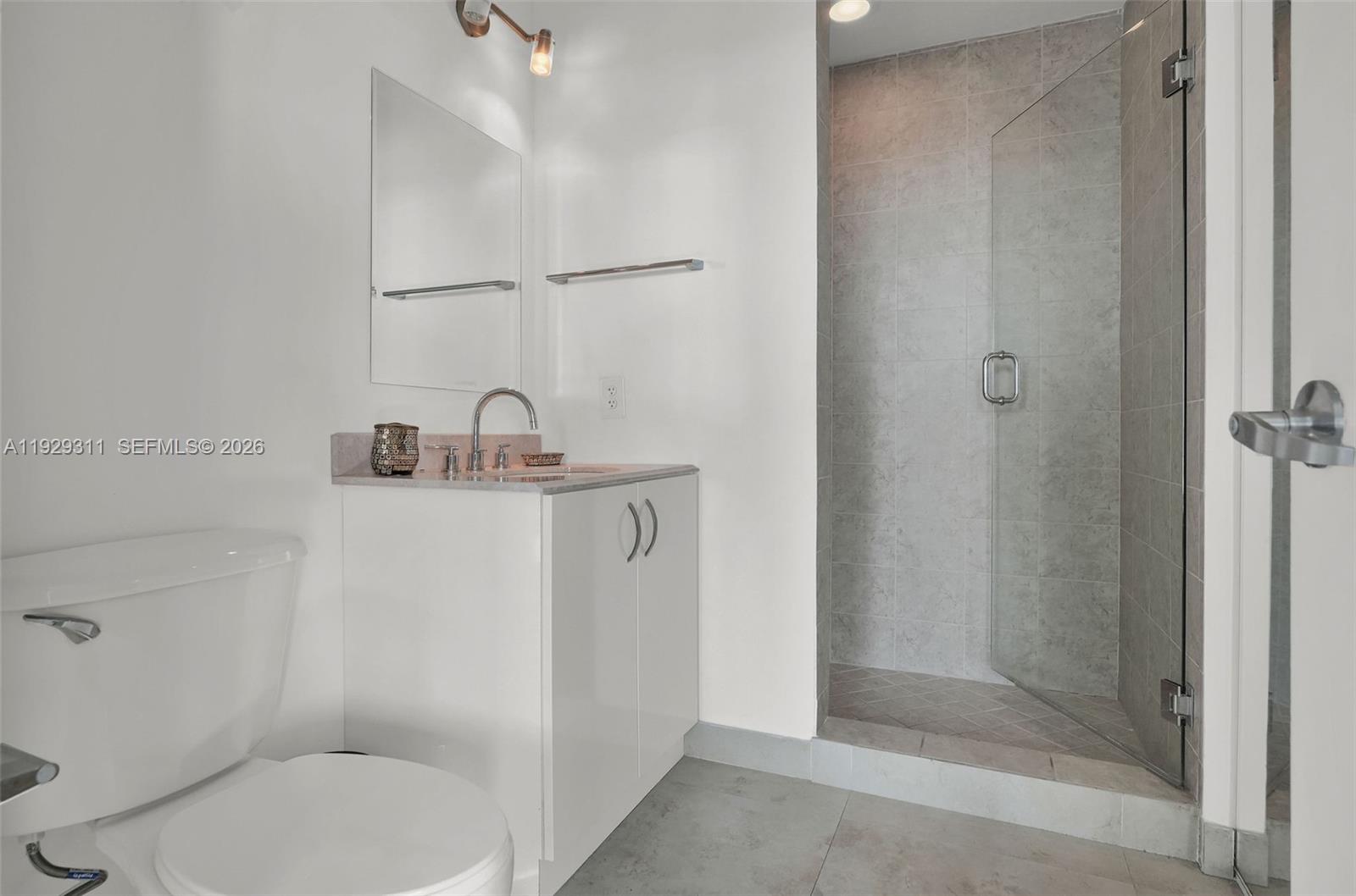 60 Southwest 13th Street, Unit 4607 Miami, FL 33130 - Photo 18 of 39 a bathroom with a toilet and a sink