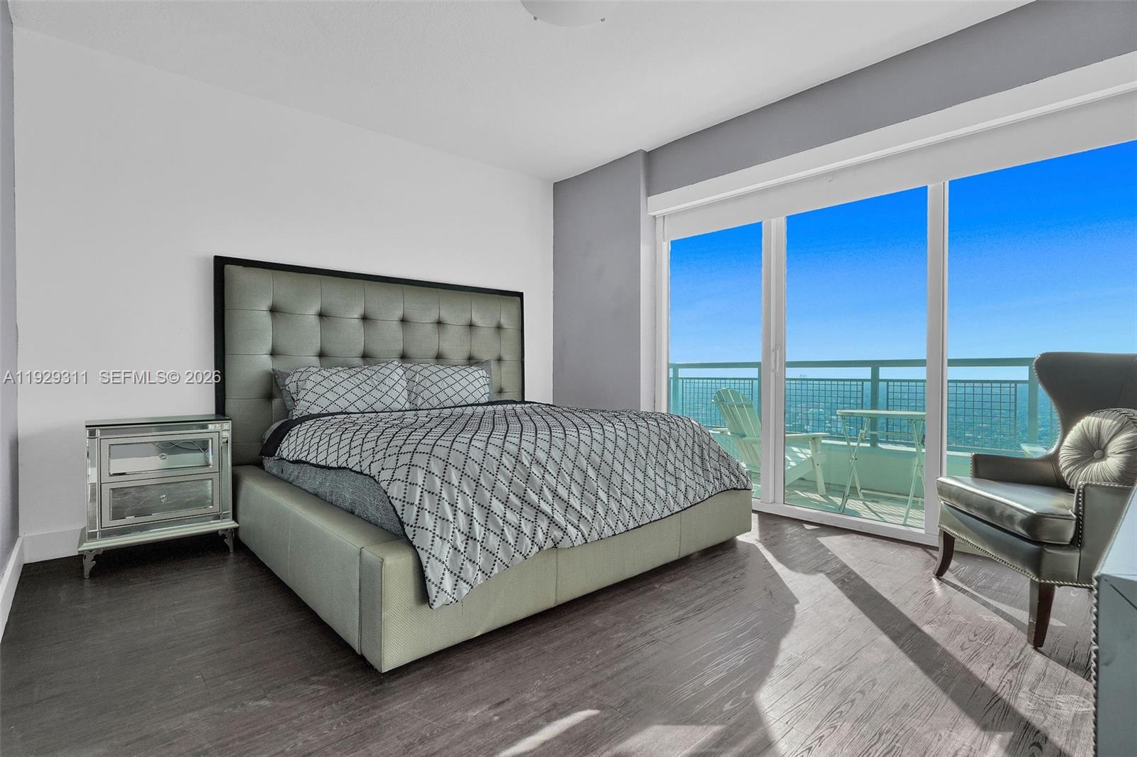 60 Southwest 13th Street, Unit 4607 Miami, FL 33130 - Photo 20 of 39 a bedroom with a bed and a window