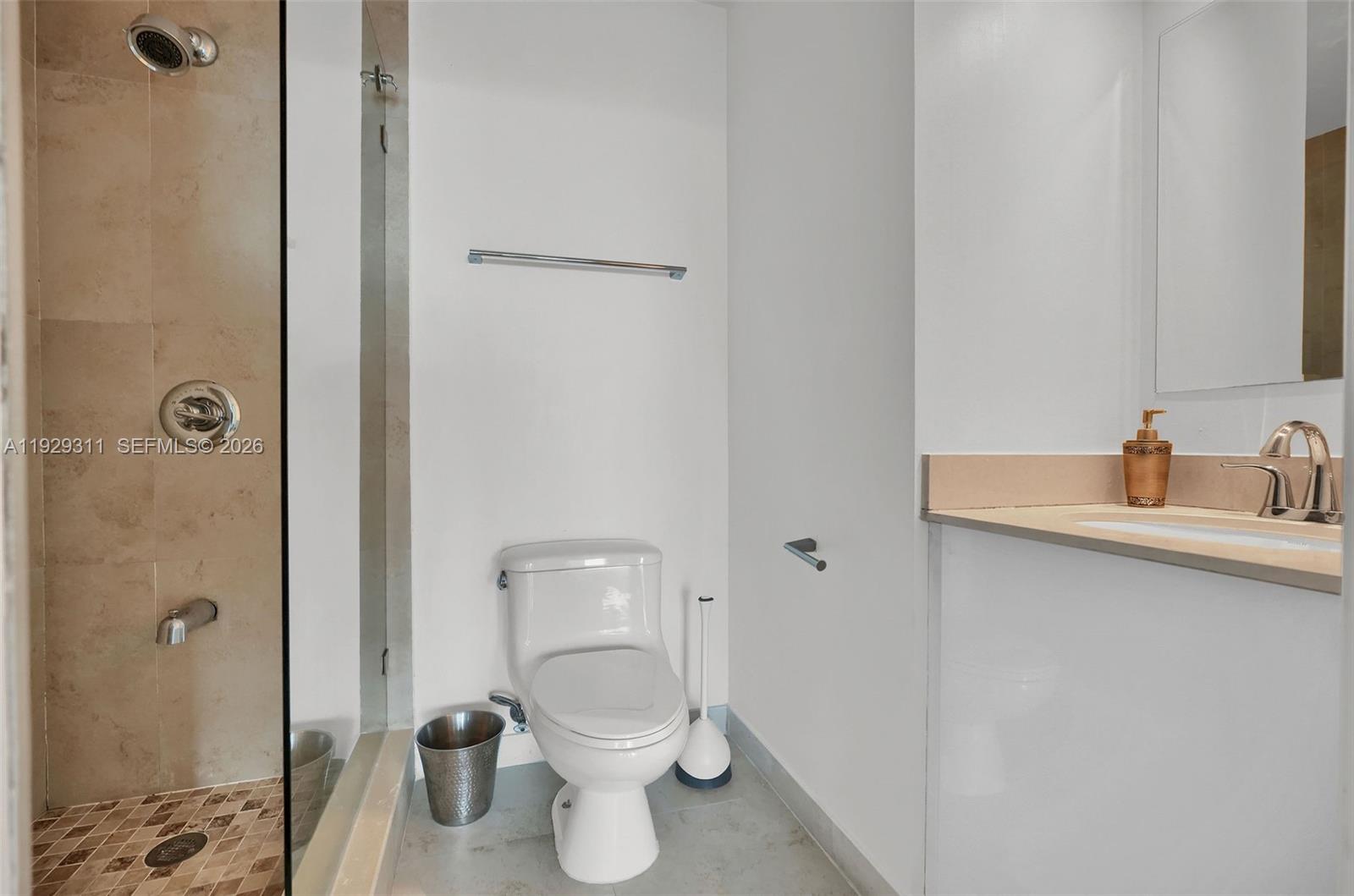 60 Southwest 13th Street, Unit 4607 Miami, FL 33130 - Photo 24 of 39 a bathroom with a sink and a toilet