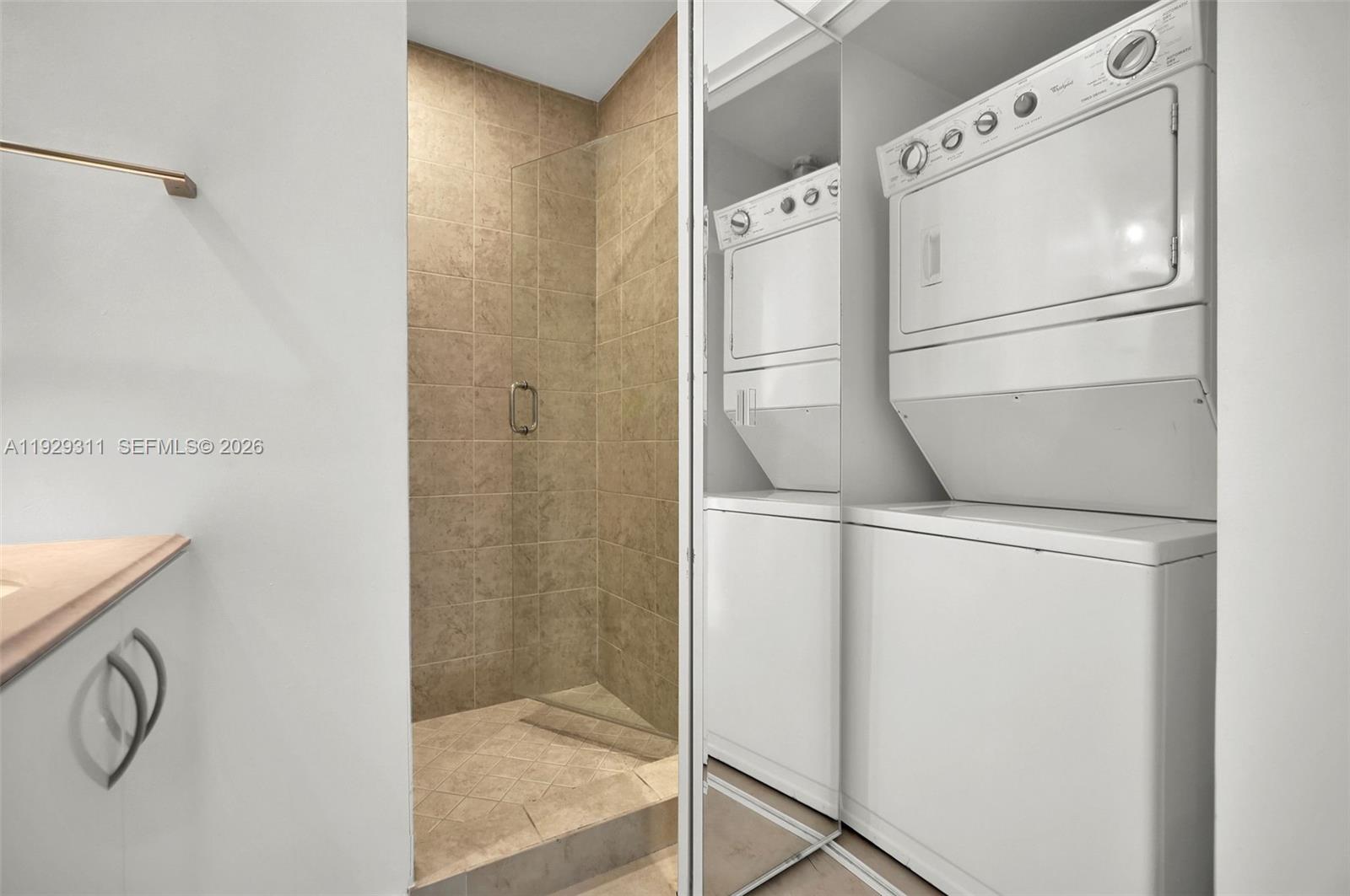 60 Southwest 13th Street, Unit 4607 Miami, FL 33130 - Photo 25 of 39 a white refrigerator freezer and a dishwasher sitting in a kitchen