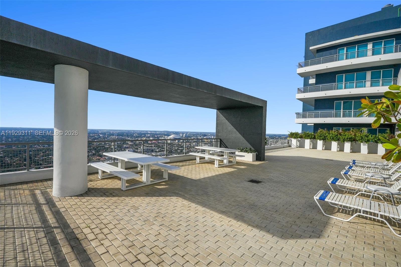 60 Southwest 13th Street, Unit 4607 Miami, FL 33130 - Photo 33 of 39 a view of a swimming pool with a lounge chairs