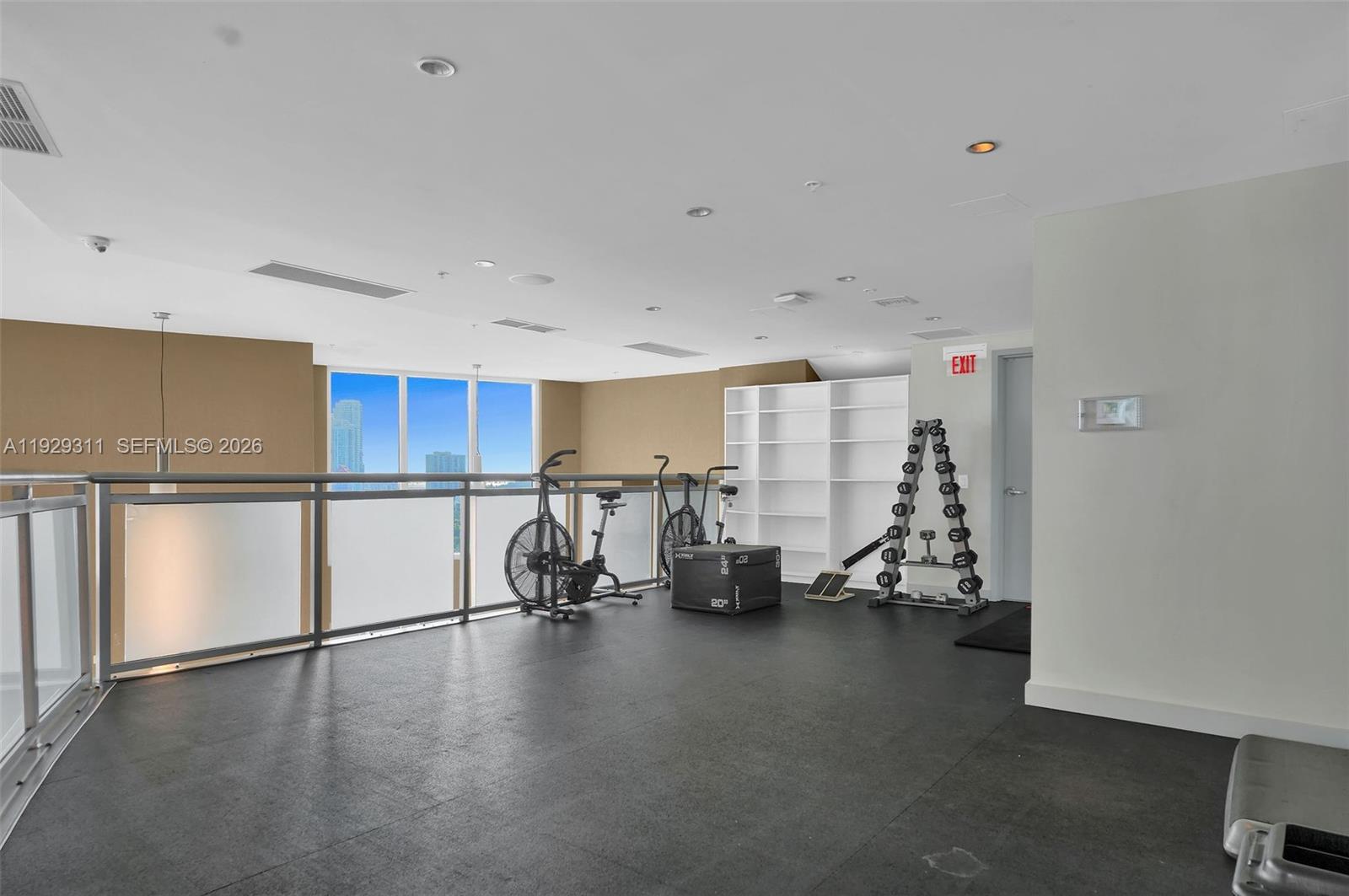 60 Southwest 13th Street, Unit 4607 Miami, FL 33130 - Photo 37 of 39 a view of a kitchen with refrigerator and chairs