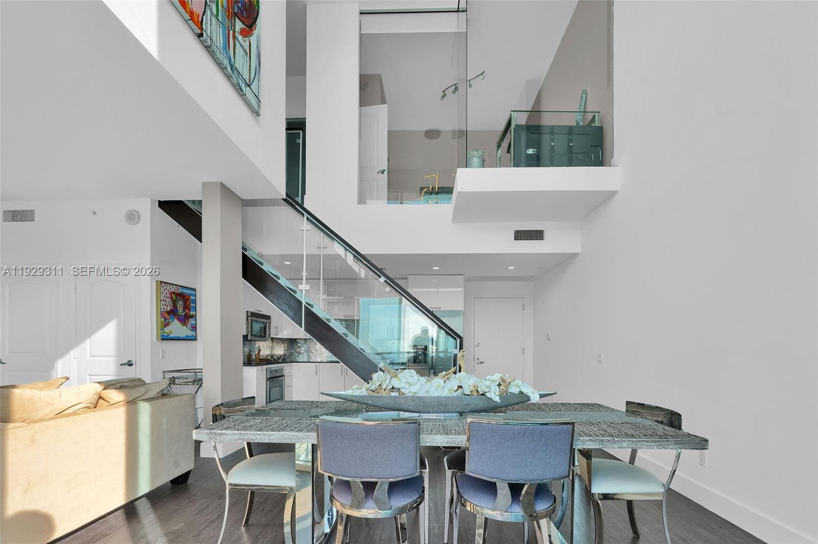 60 Southwest 13th Street, Unit 4607 Miami, FL 33130 - Photo 6 of 39 a view of a dining room with furniture and a table