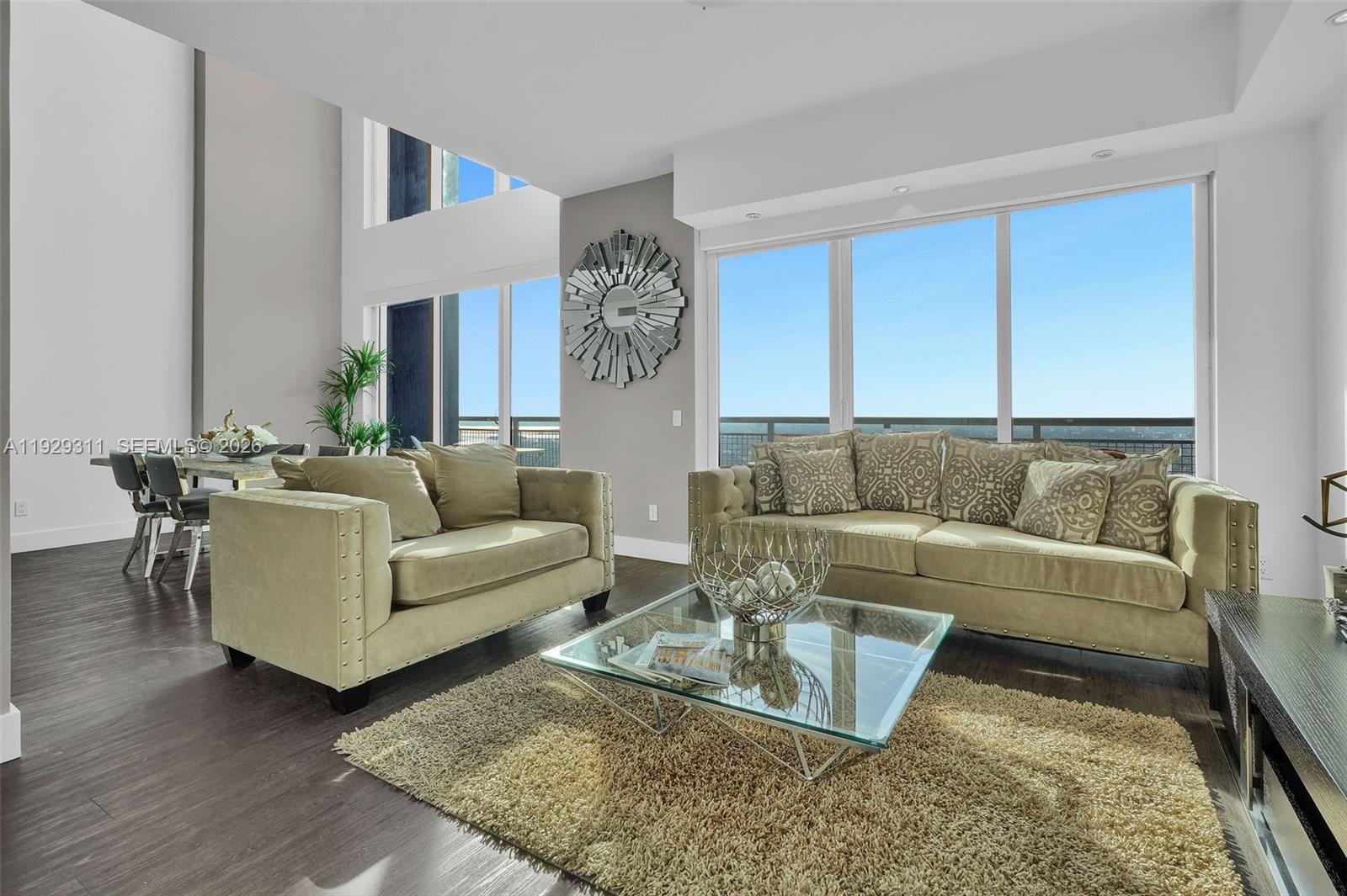 60 Southwest 13th Street, Unit 4607 Miami, FL 33130 - Photo 10 of 39 a living room with furniture and a rug