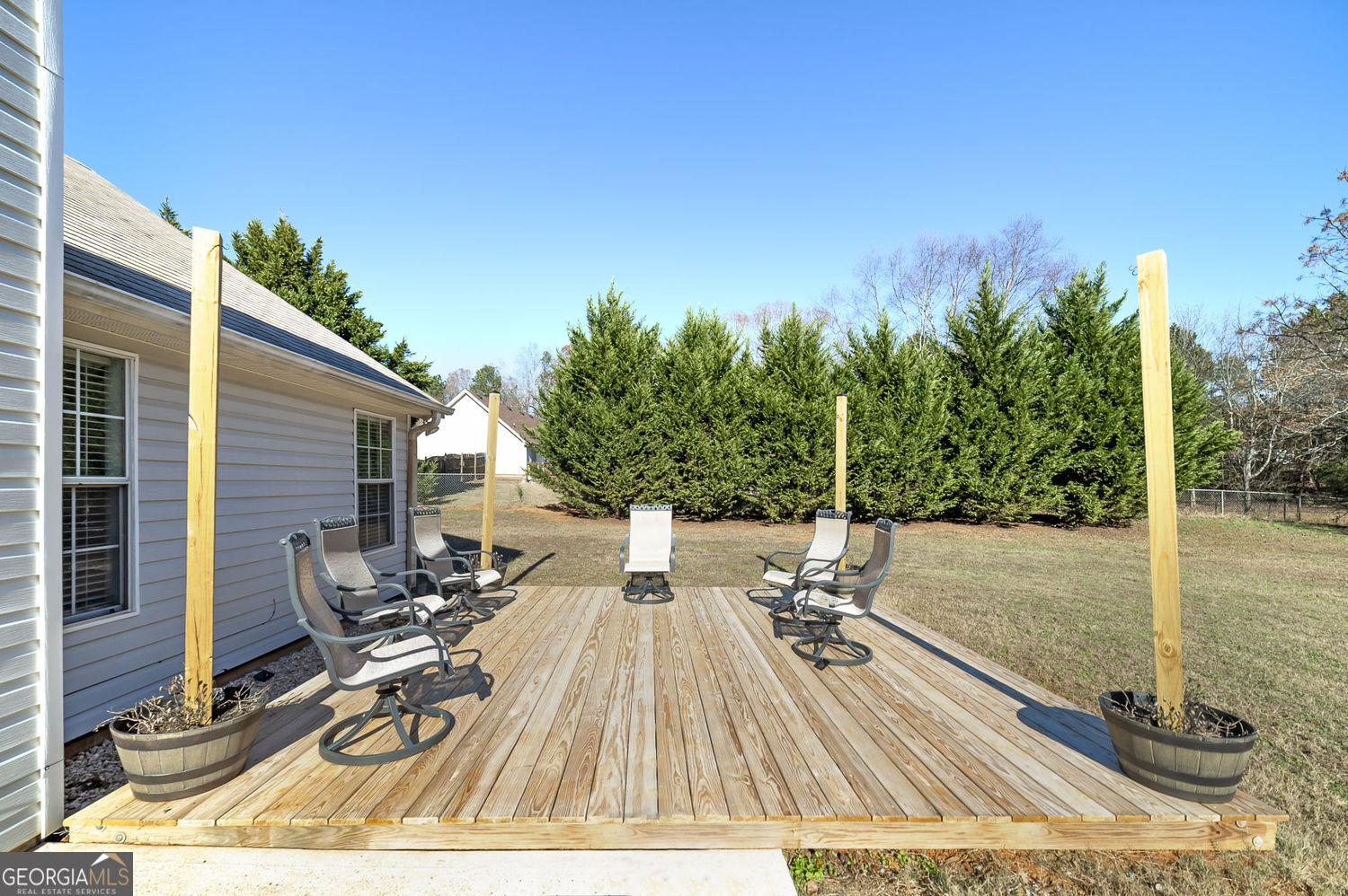 524 Leguin Mill Road Locust Grove, GA 30248 - Photo 12 of 44 a view of a backyard with chairs