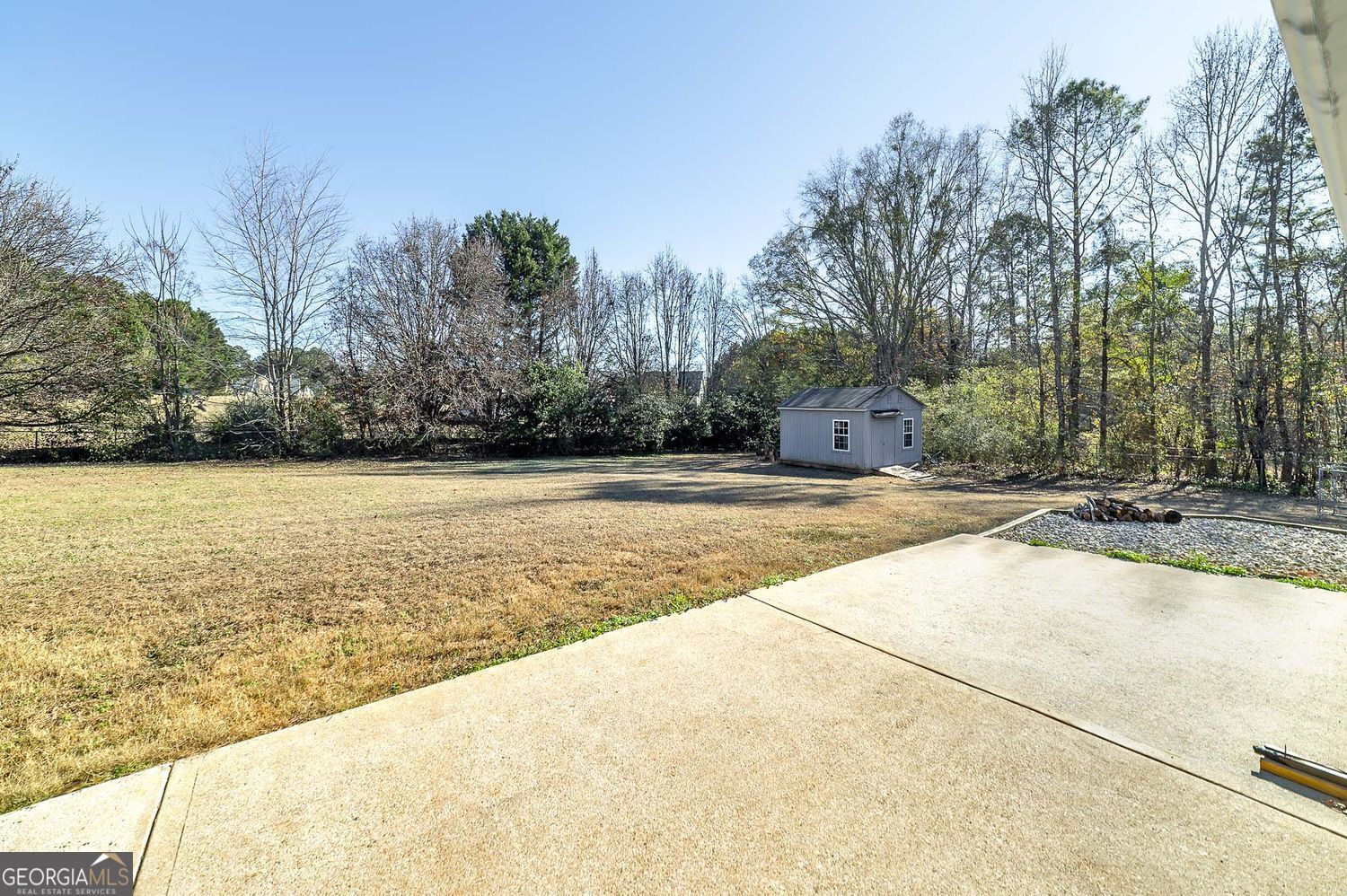 524 Leguin Mill Road Locust Grove, GA 30248 - Photo 13 of 44 a view of swimming pool with an outdoor space and seating area