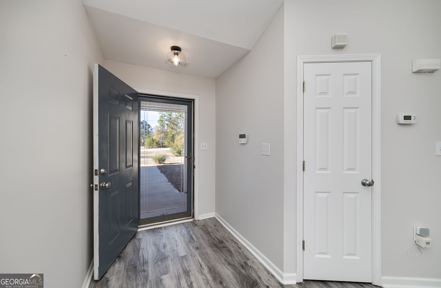 524 Leguin Mill Road Locust Grove, GA 30248 - Photo 16 of 44 wooden floor in an empty room