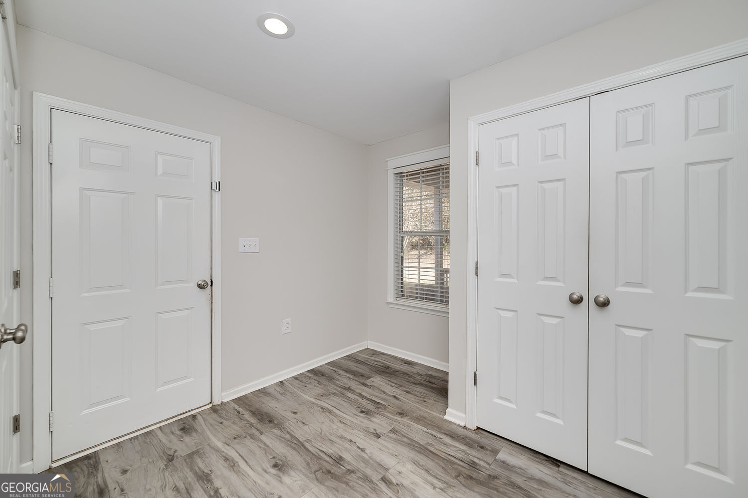 524 Leguin Mill Road Locust Grove, GA 30248 - Photo 27 of 44 a view of an empty room and wooden floor