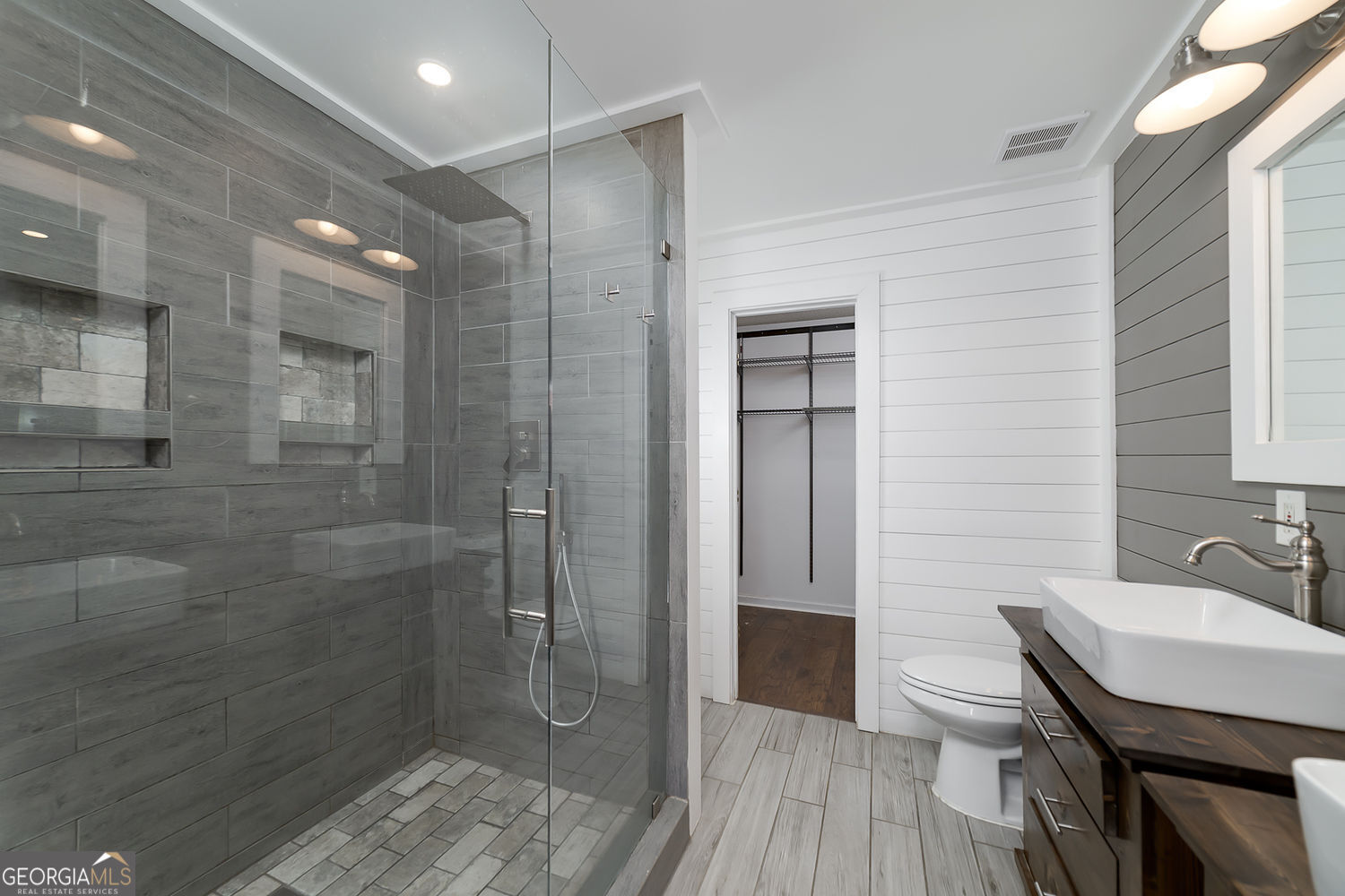 524 Leguin Mill Road Locust Grove, GA 30248 - Photo 31 of 44 a bathroom with a sink shower and a toilet