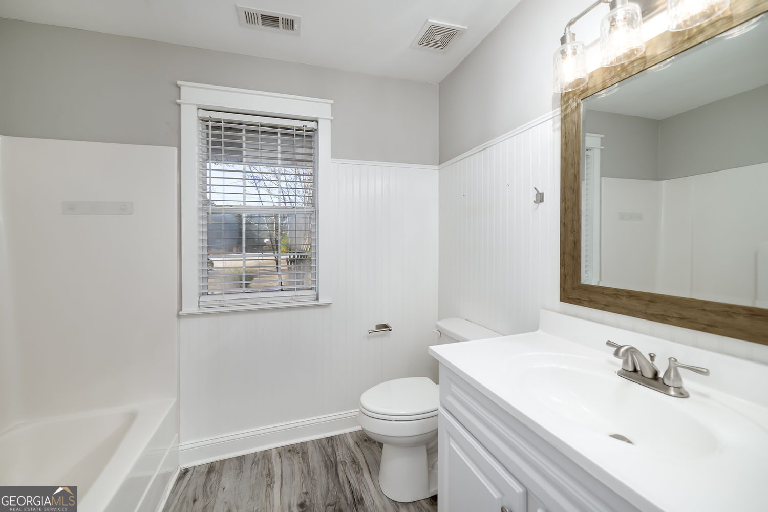 524 Leguin Mill Road Locust Grove, GA 30248 - Photo 37 of 44 a bathroom with a sink a toilet and shower