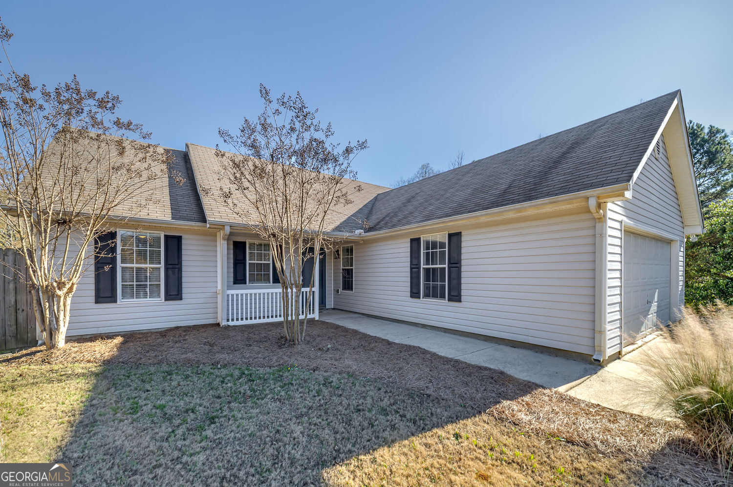 524 Leguin Mill Road Locust Grove, GA 30248 - Photo 39 of 44 a front view of a house with a yard and garage