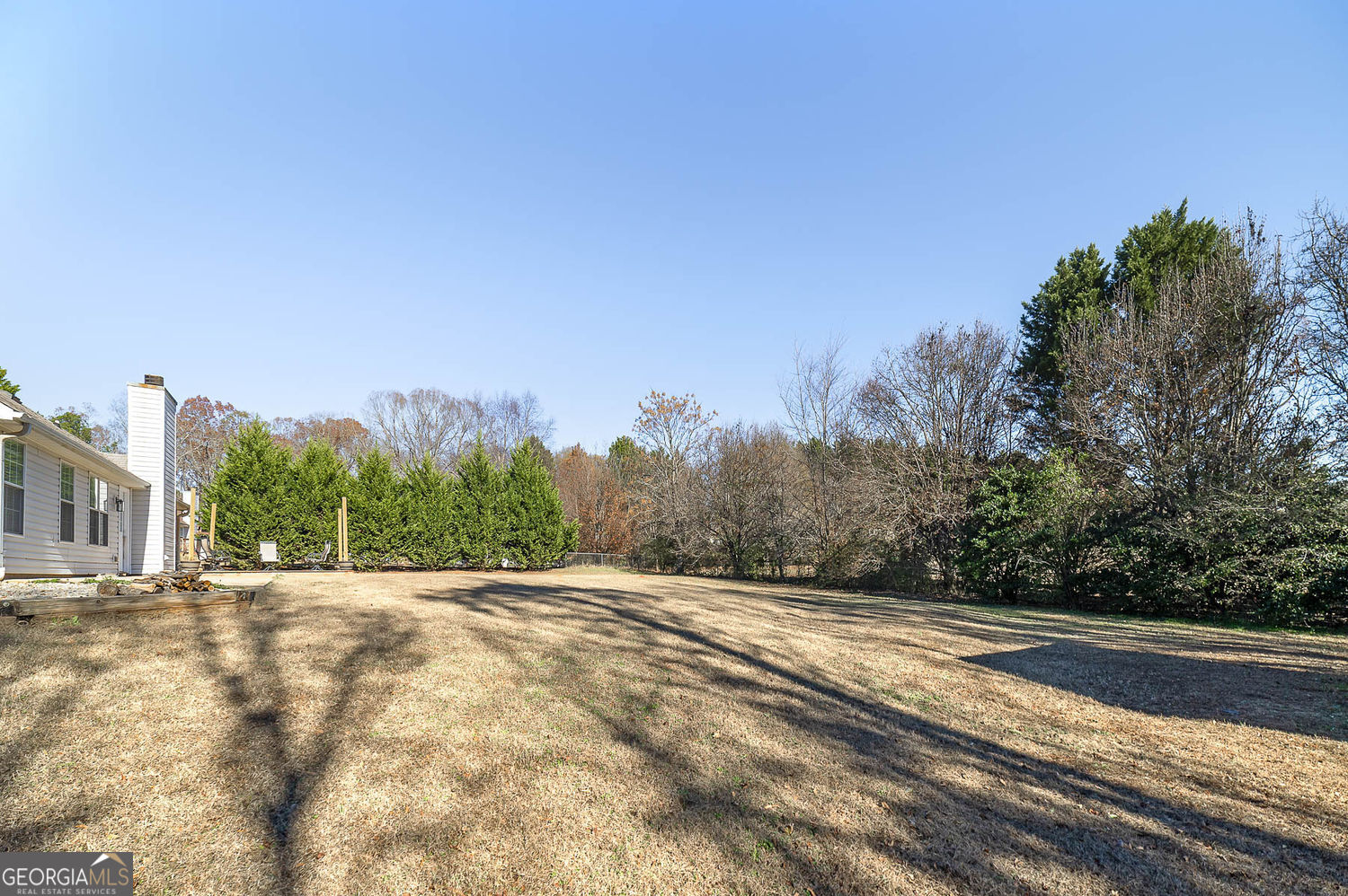 524 Leguin Mill Road Locust Grove, GA 30248 - Photo 6 of 44 a view of an outdoor space with trees