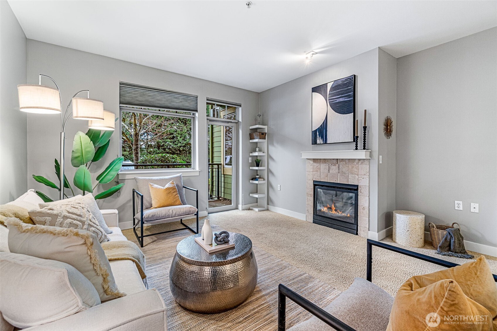 a living room with furniture and a fireplace