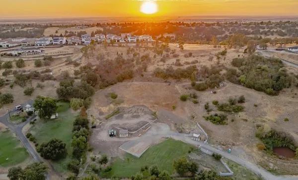 an aerial view of a houses with a yard