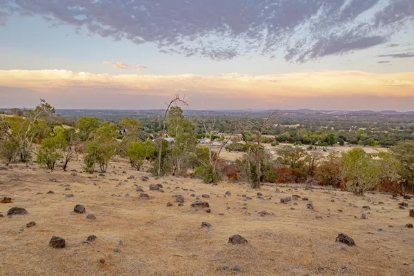a view of a yard with a mountain