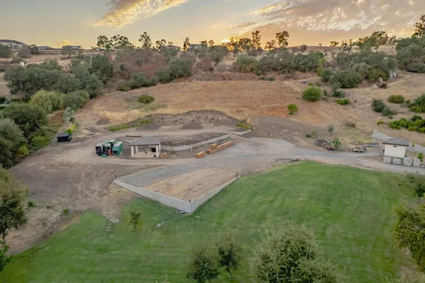 an aerial view of a house with outdoor space