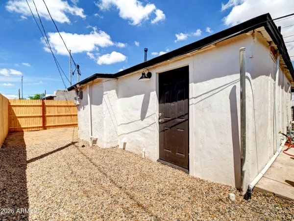 a view of a back yard with an outdoor space
