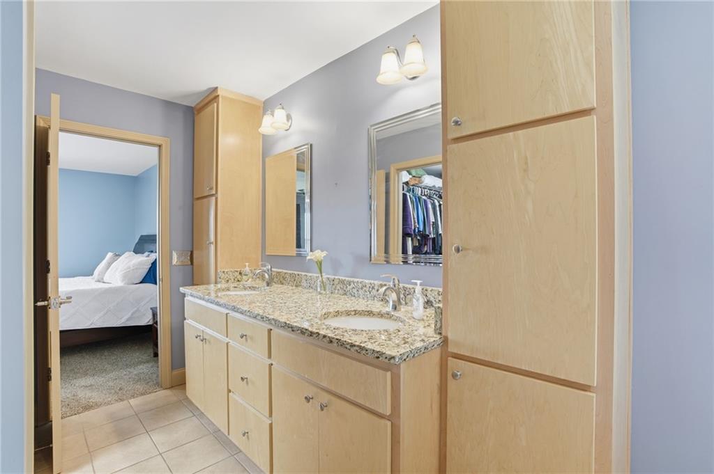 3326 Monument Road Jasper, GA 30143 - Photo 19 of 49 a en suite bathroom with a double vanity sink and a mirror