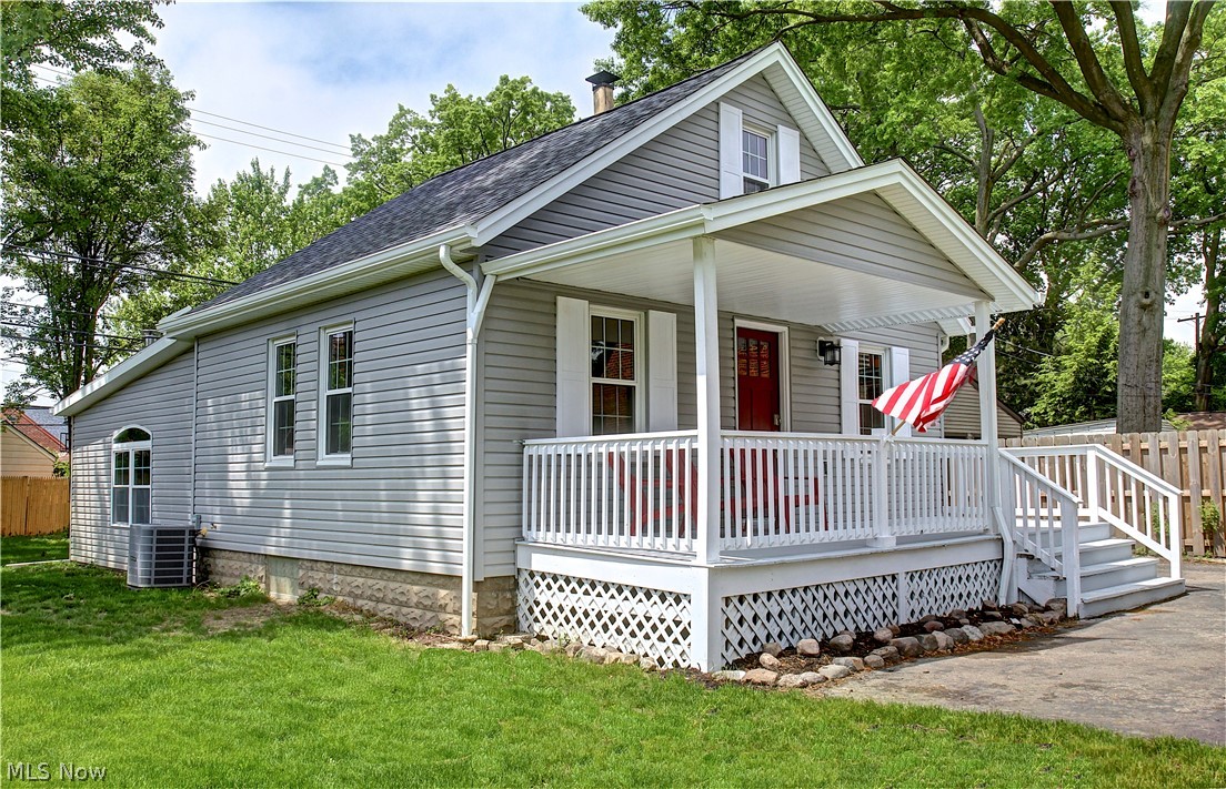 14507 Glencliffe Road Cleveland, OH 44111 - Photo 1 of 31 View of front of house with a front yard, central AC unit, and a porch