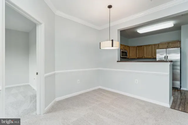a view of a kitchen with a sink and dishwasher cabinets