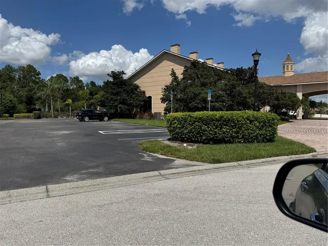 a view of a house with a yard and a garden