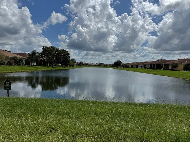 a view of a lake with a big yard