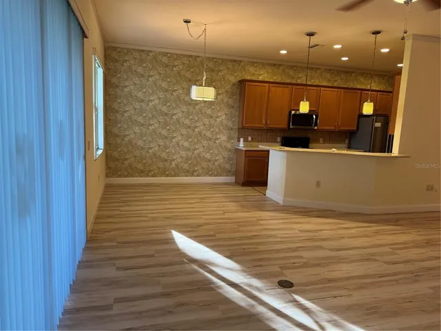 a view of a bathroom with a sink a mirror and a shower