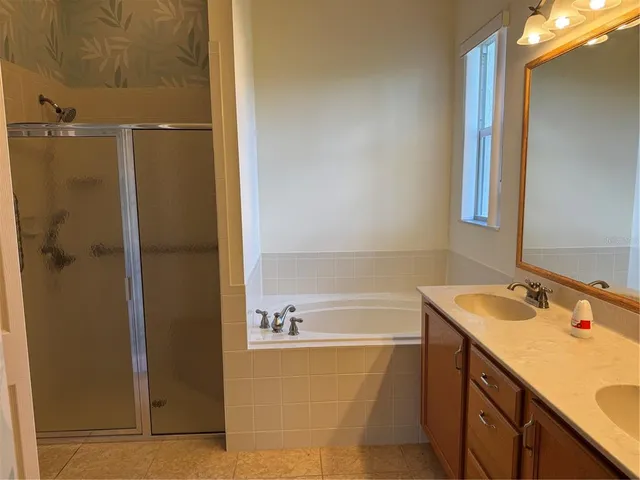 a bathroom with a sink and a shower
