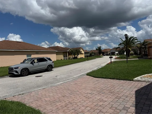 a view of a car parked in the yard