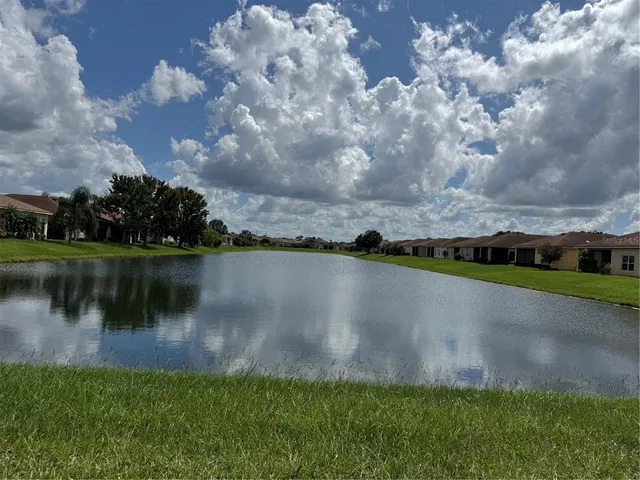 a view of a lake with a yard