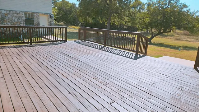 a view of a balcony with wooden floor