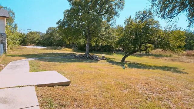 a view of a swimming pool with an outdoor space and seating area