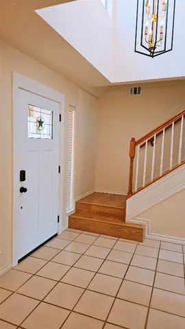 a view of an entryway with wooden floor