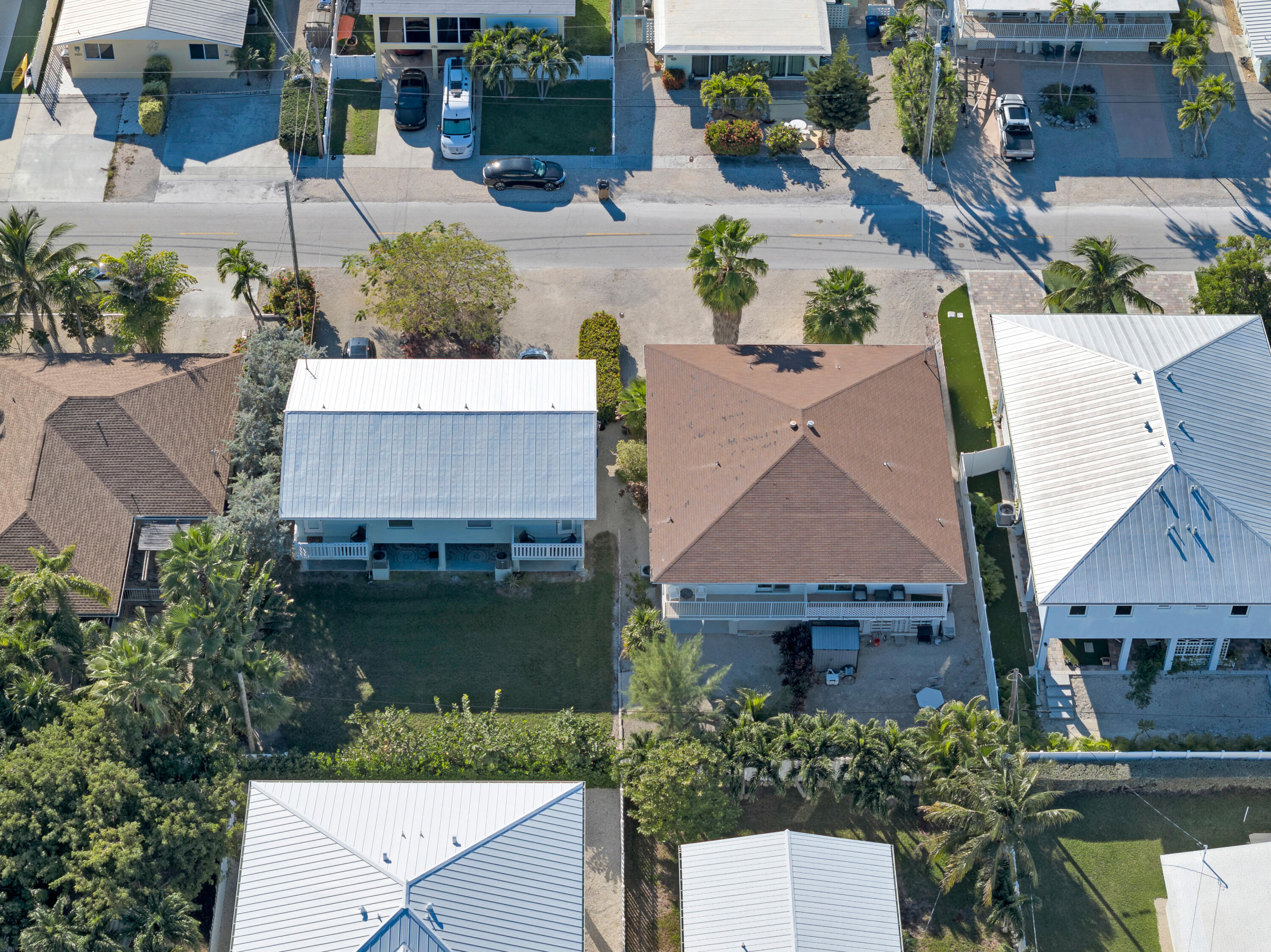 300 3rd Street Key Colony Beach, FL 33051 - Photo 15 of 51 an aerial view of a house with garden space and a patio