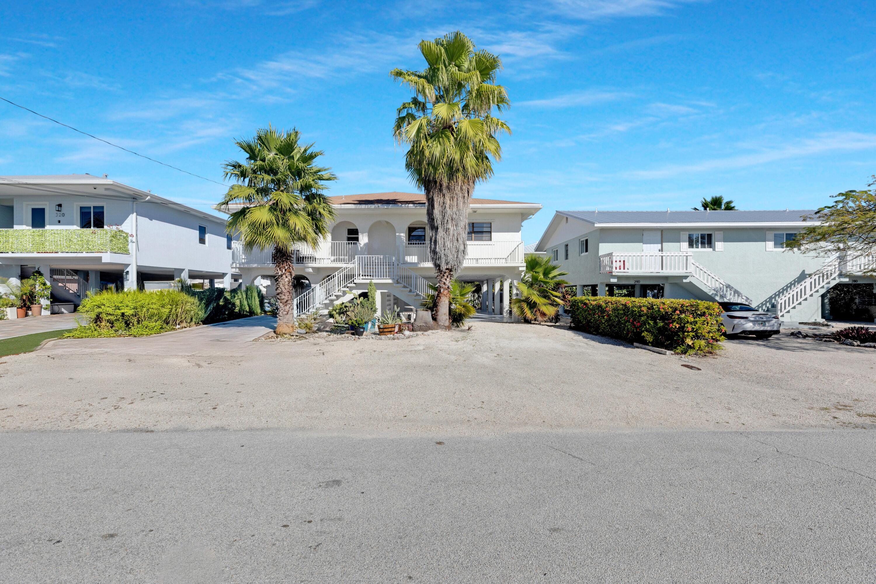 300 3rd Street Key Colony Beach, FL 33051 - Photo 16 of 51 a picture of a table and chairs in patio
